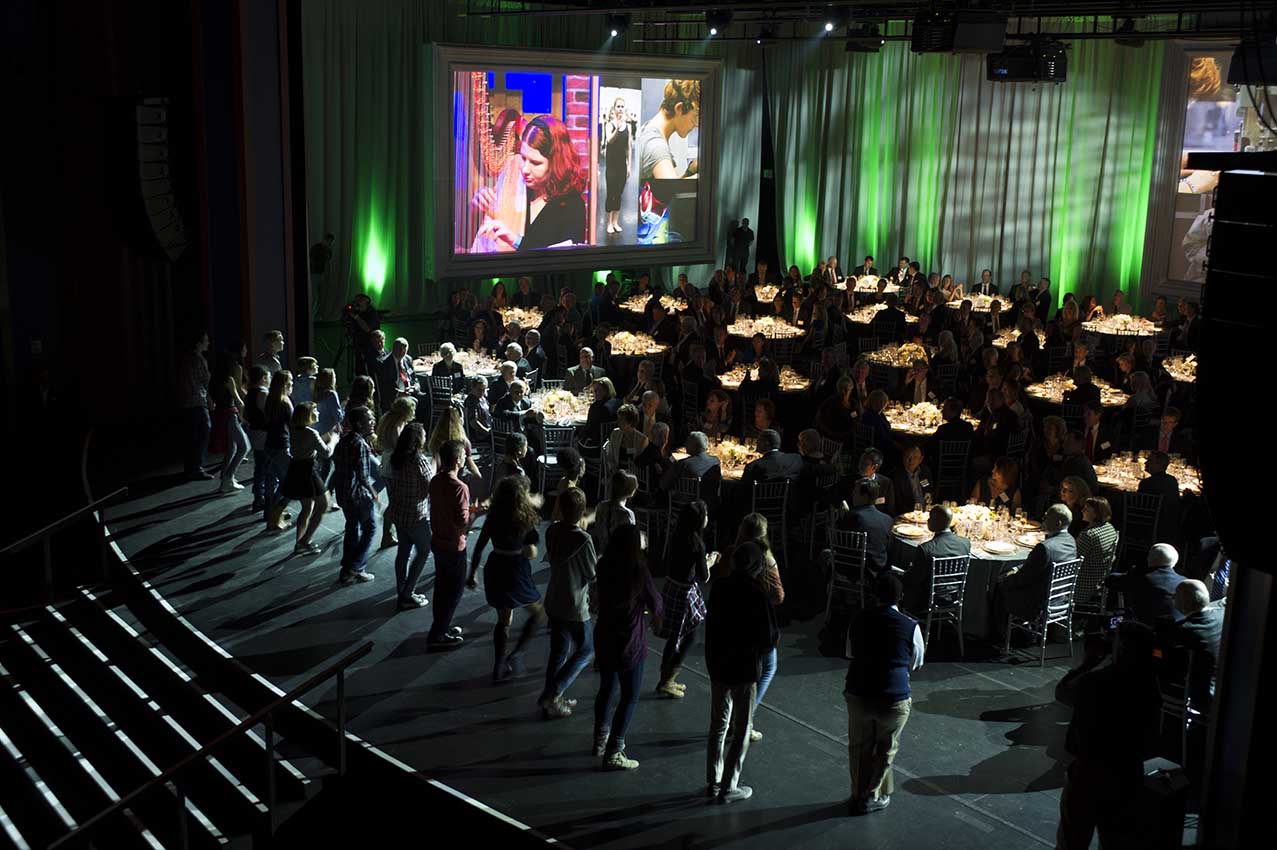 Corporate dinner event on a theater stage with live entertainment 30 Years of Events 15